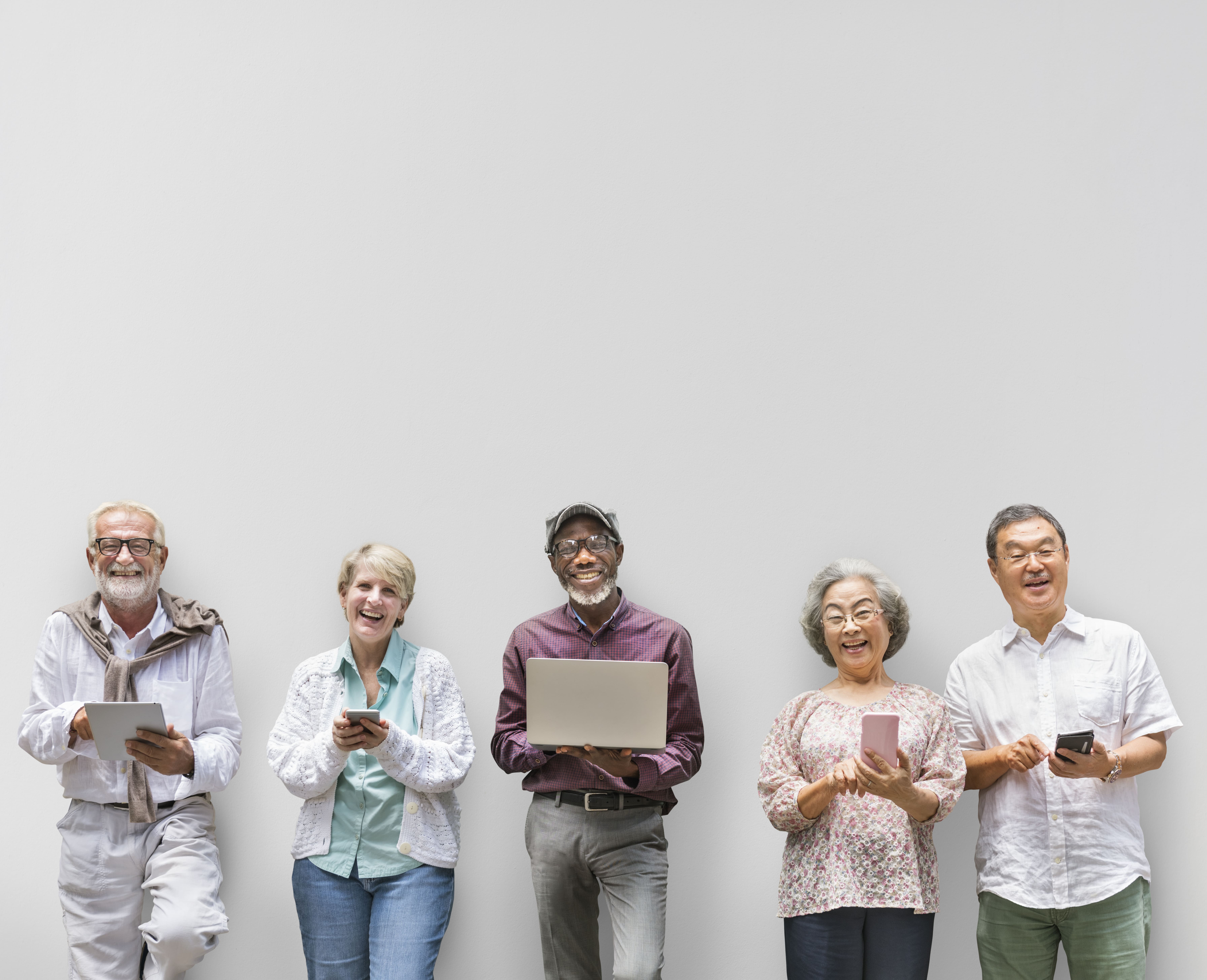 A diverse group of retirees laugh together