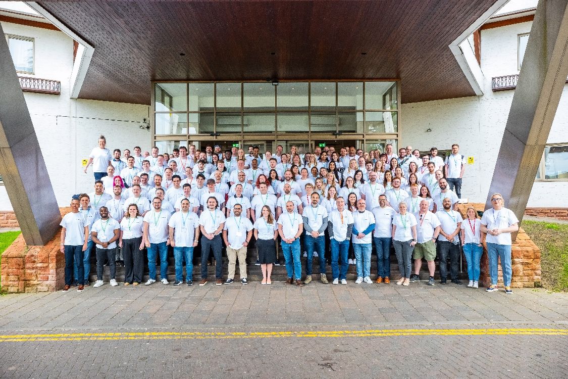 The Nourish team smiles outside the Coppid Beech hotel for their 2025 kick off