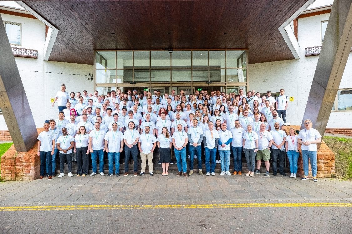 The Nourish team smiles outside the Coppid Beech hotel for their 2025 kick off