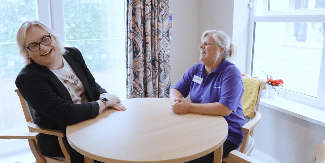 The two women laugh and talk animatedly during their interview