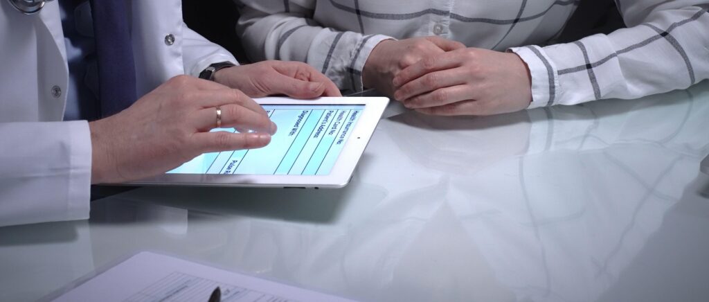 social care interoperability platform people using a device to input data